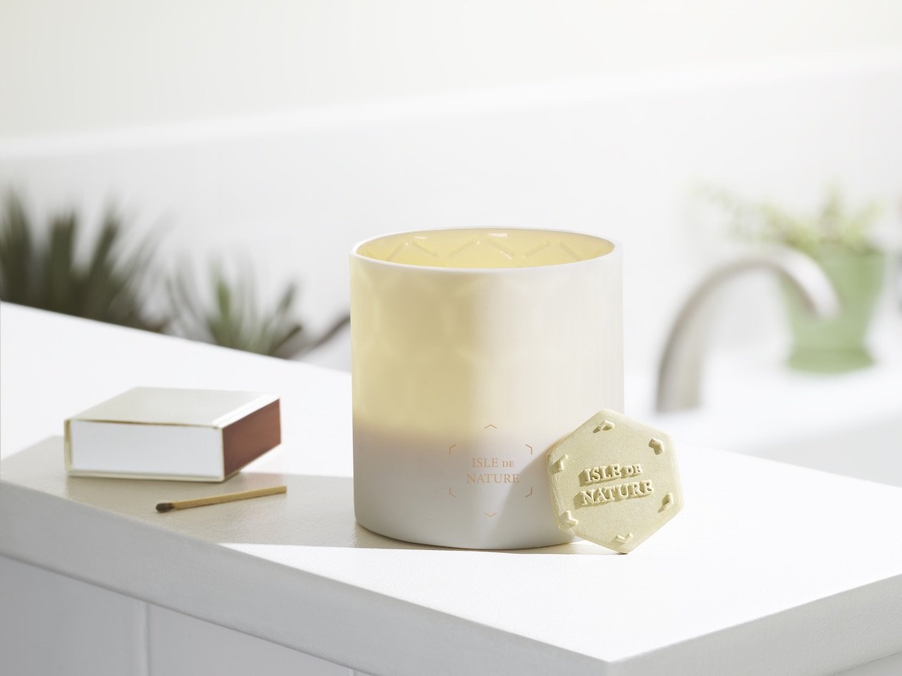 Pagua Bay Fragrance Luxury Beeswax Candle in a unique translucent clay vessel, showcasing a delicate honeycomb pattern.