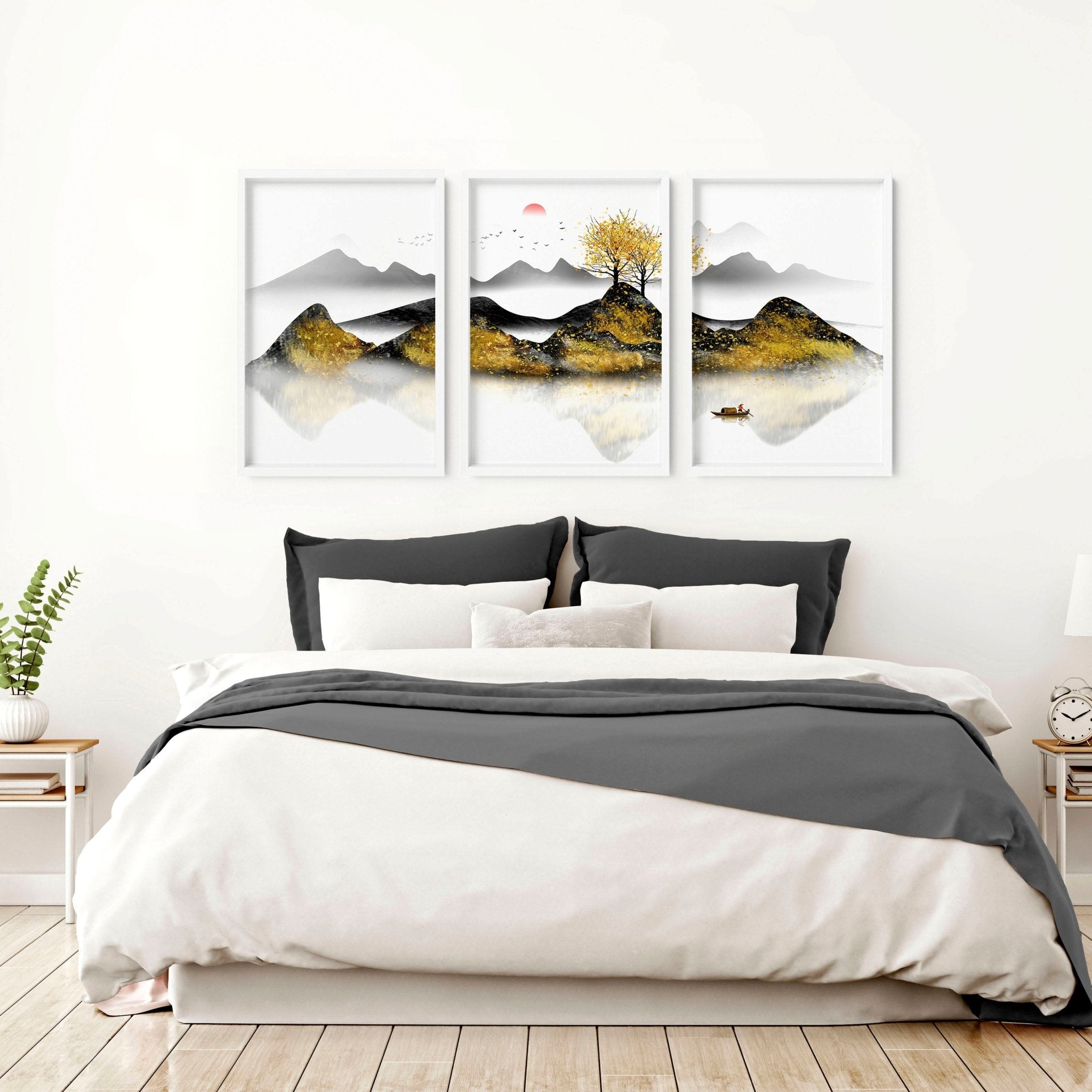 Set of 3 framed wall art prints depicting serene Japanese sunrise landscapes with shimmering gold details, perfect for bedroom decor.