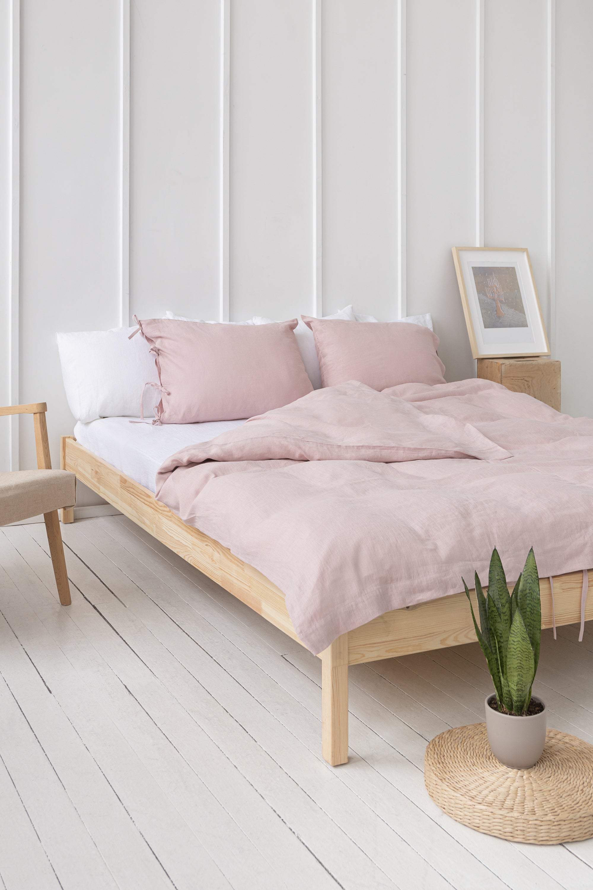 Pale Pink linen bedding set featuring duvet cover, bedsheet, and pillowcases with tie closures, elegantly styled for a minimalist bedroom.