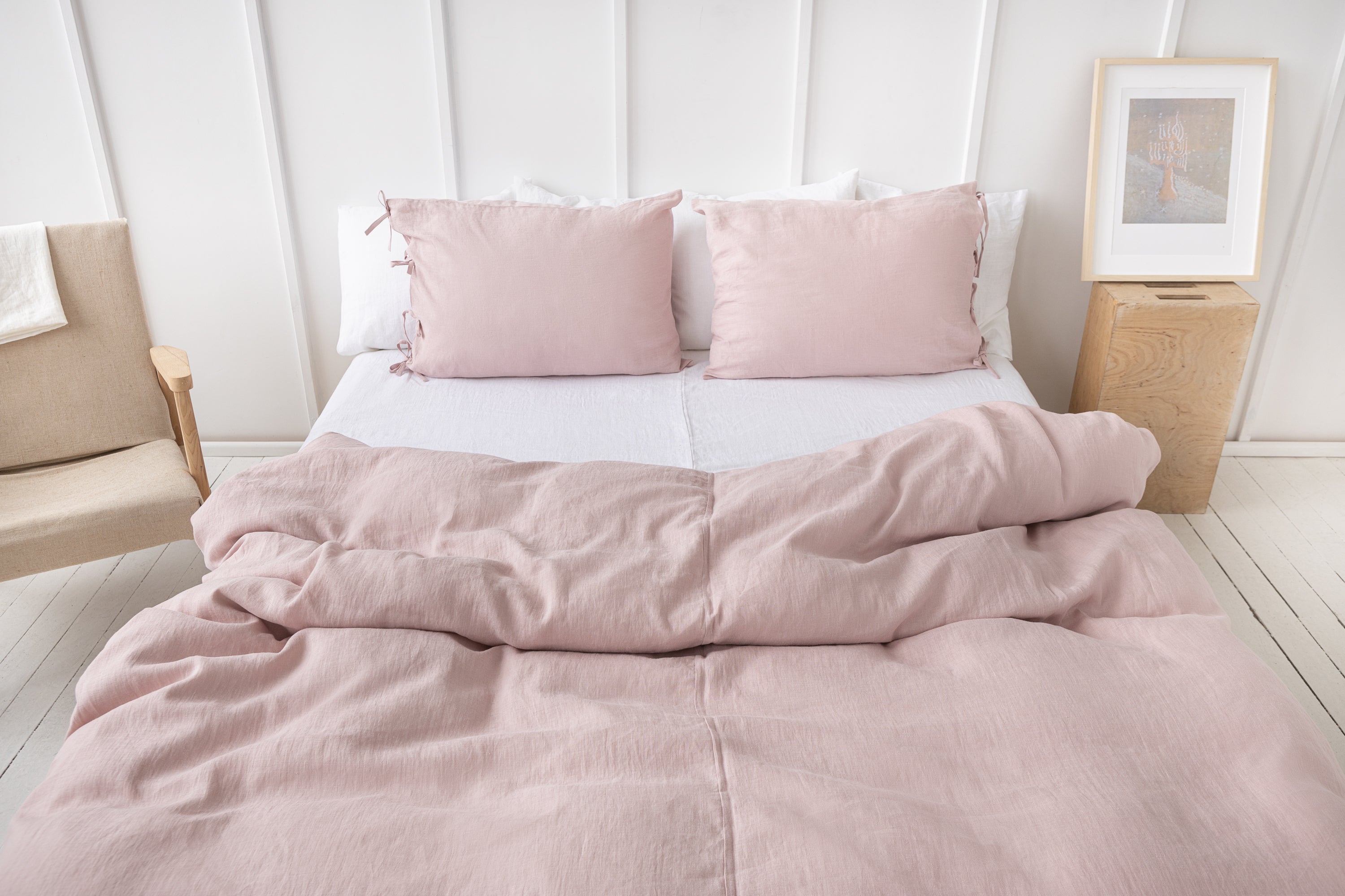 Pale Pink linen bedding set featuring duvet cover, bedsheet, and pillowcases with tie closures, elegantly styled for a minimalist bedroom.