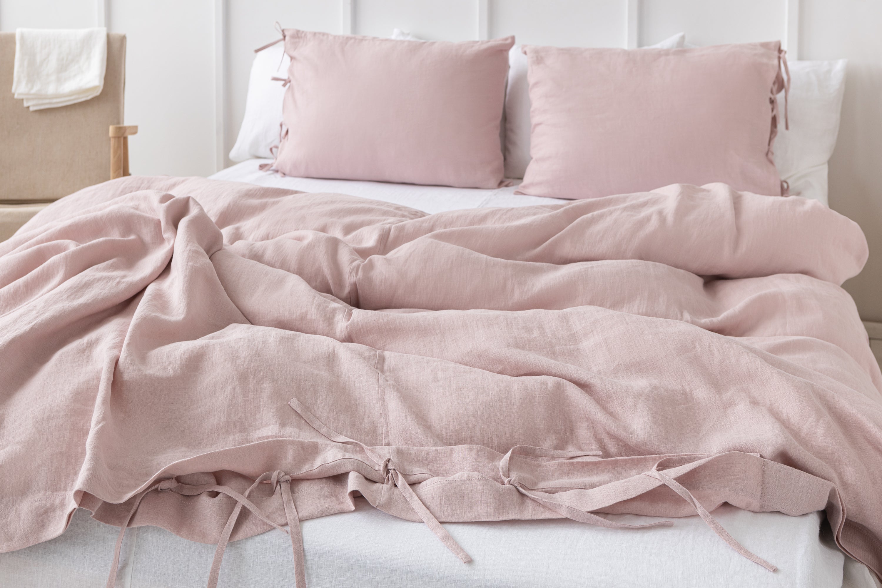 Pale Pink linen bedding set featuring duvet cover, bedsheet, and pillowcases with tie closures, elegantly styled for a minimalist bedroom.