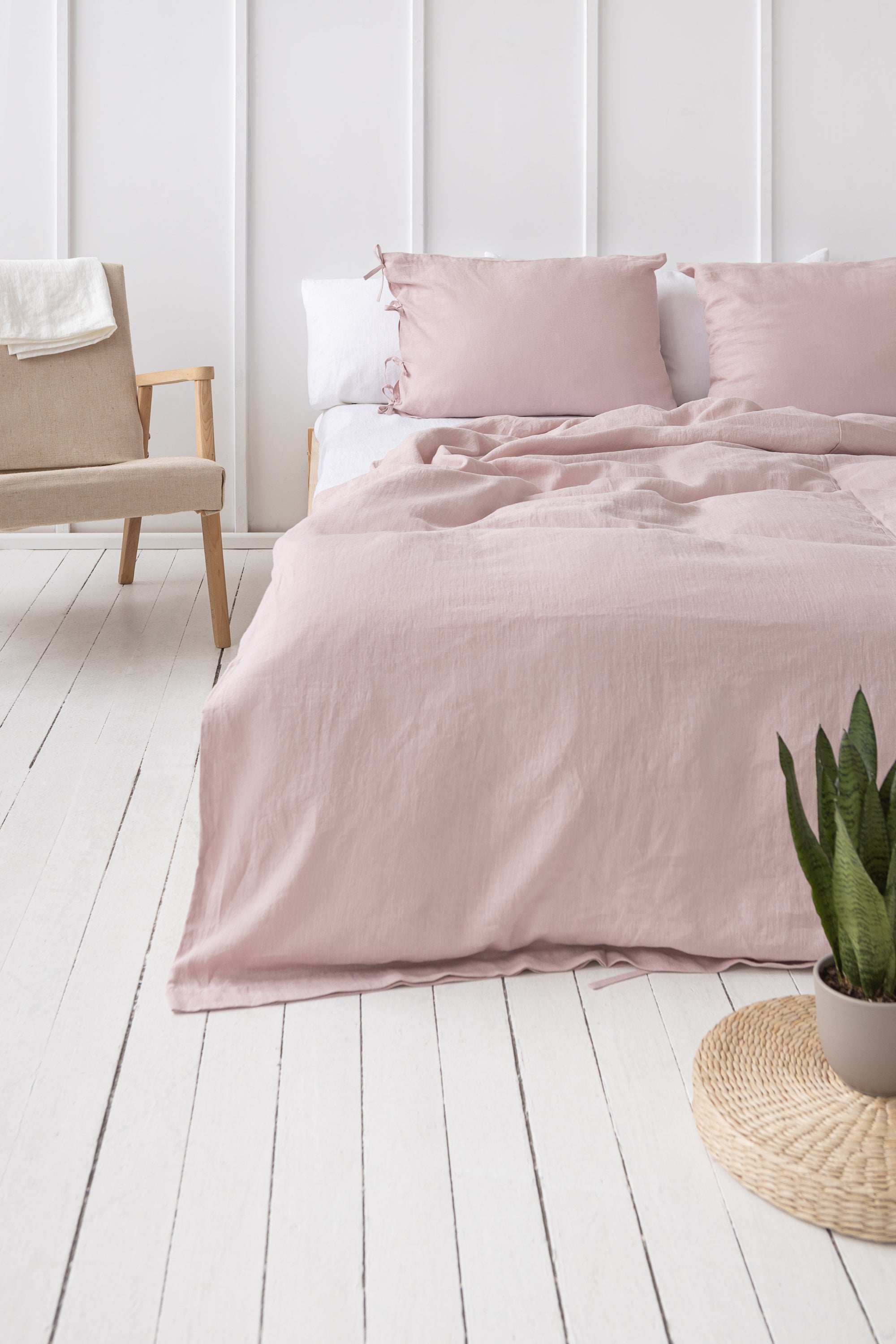 Pale Pink linen bedding set featuring duvet cover, bedsheet, and pillowcases with tie closures, elegantly styled for a minimalist bedroom.