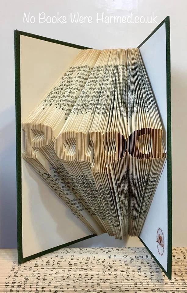 Hand-folded book art piece named 'Papa', crafted from vintage books, showcasing intricate folds and unique colors.