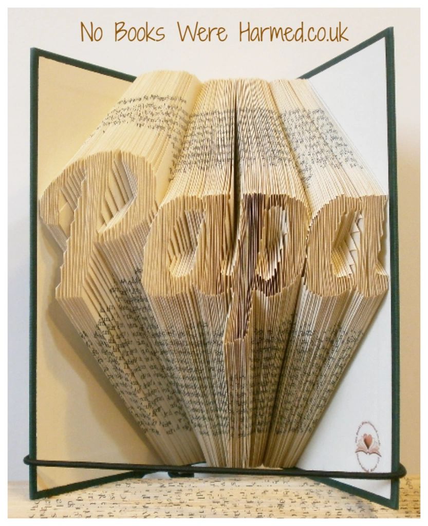 Hand-folded book art piece named 'Papa', crafted from vintage books, showcasing intricate designs and unique colors.