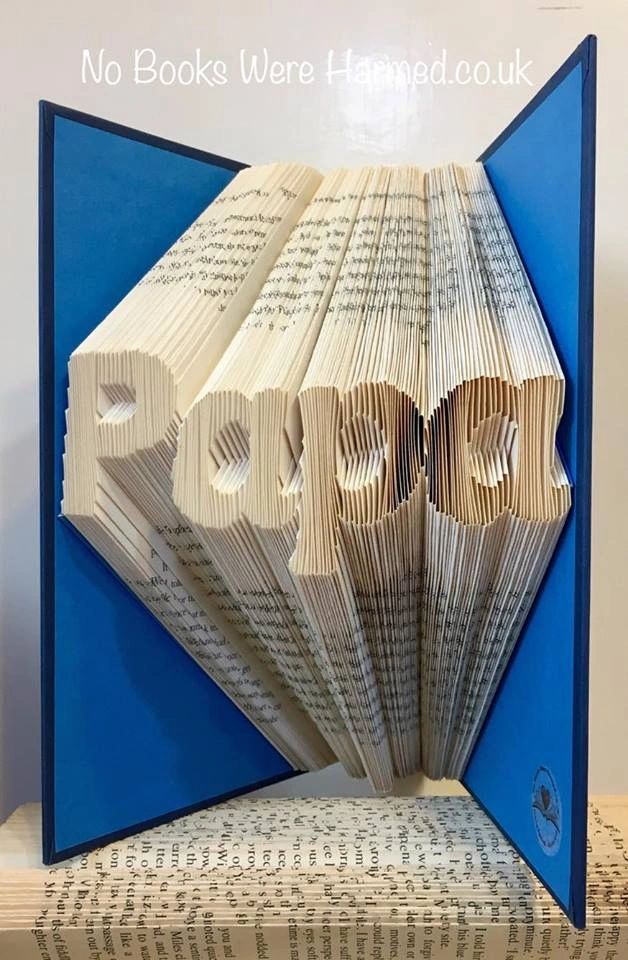 Hand-folded book art titled 'Papa', crafted from vintage books, showcasing intricate patterns and unique designs.