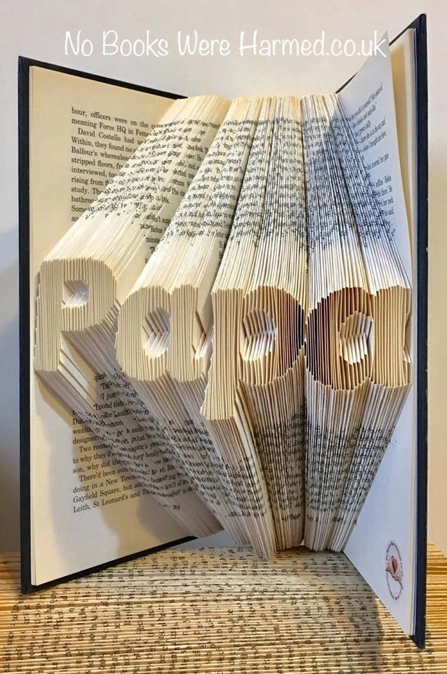 Hand-folded book art titled 'Papa', crafted from vintage books, showcasing intricate patterns and unique designs.