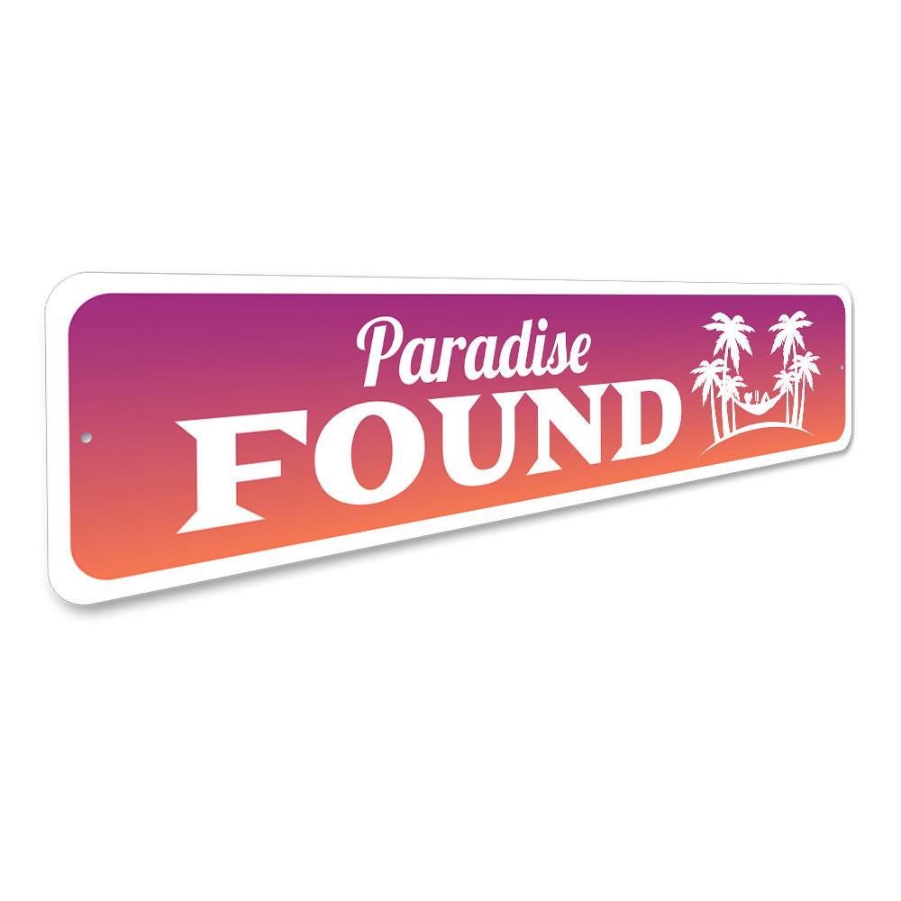 A beautifully crafted Paradise Found Sign made from high-quality aluminum, featuring beach-themed design elements, perfect for coastal decor.