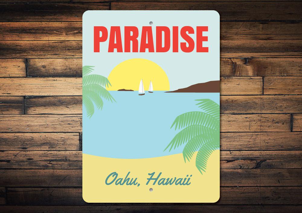 A beautifully crafted Paradise Sign made of high-quality aluminum, featuring customizable text and a coastal design, perfect for beach lovers.