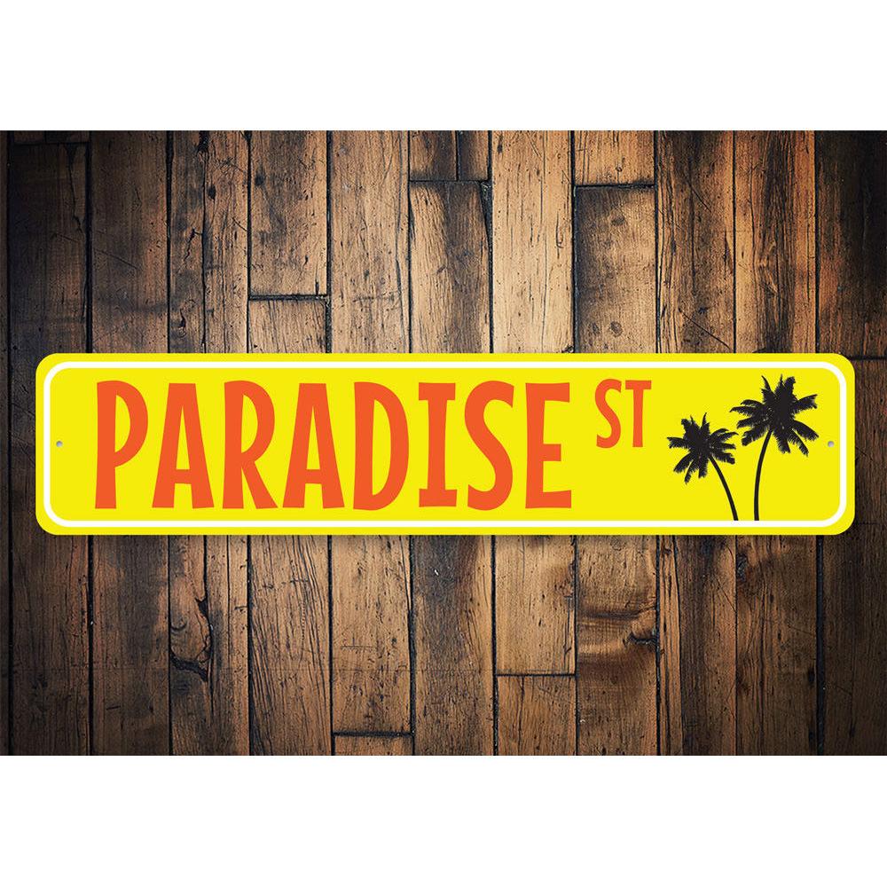 A vibrant Paradise Street Sign made of high-quality aluminum, featuring customizable text and a beach-themed design, perfect for coastal decor.