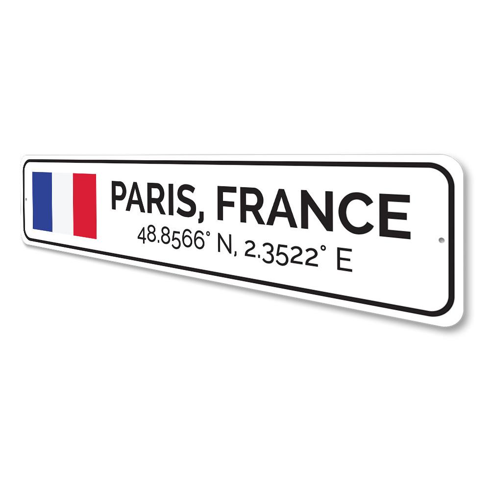 Sign reading "Paris, France" coordinates.