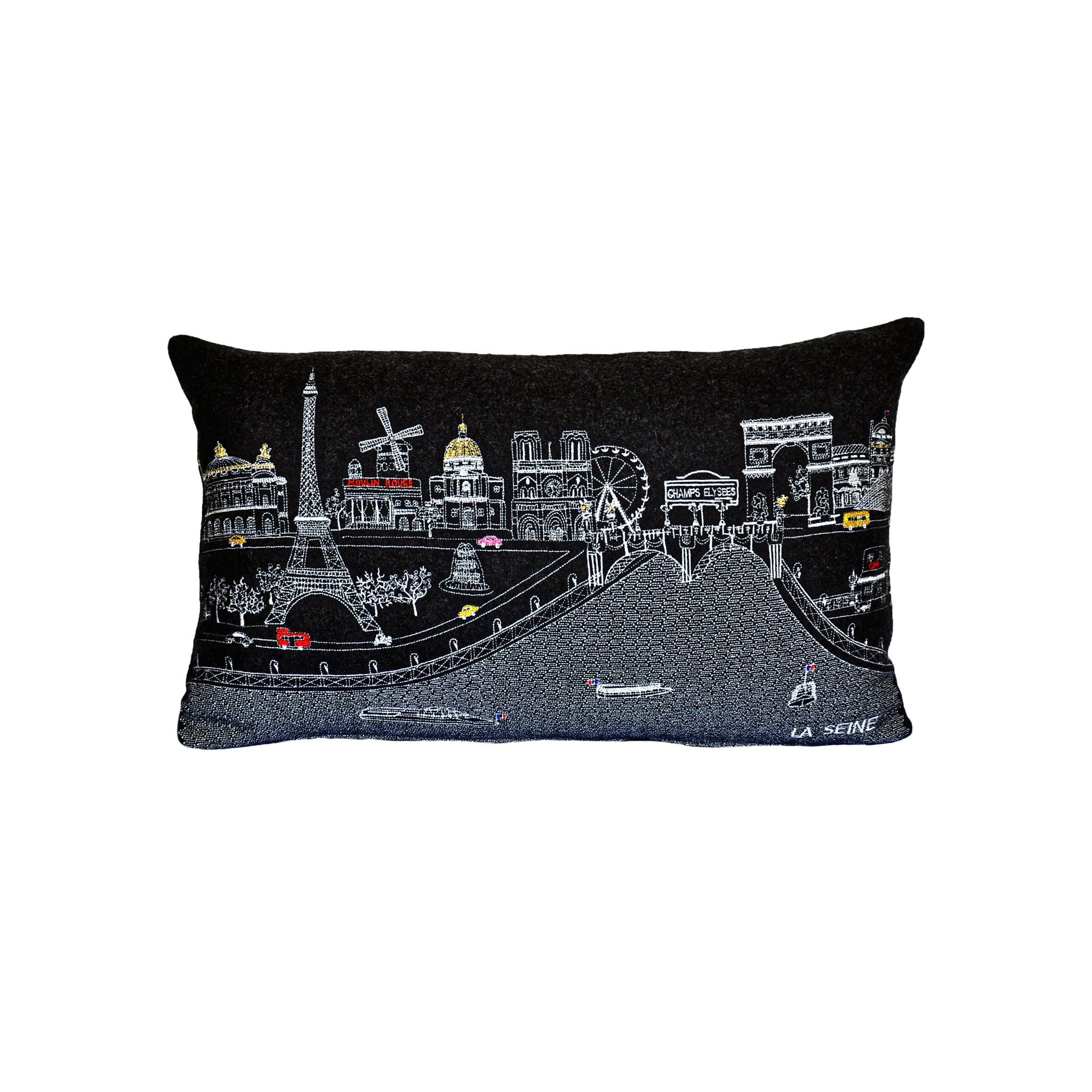 A decorative pillow featuring iconic Parisian landmarks like the Eiffel Tower and Notre-Dame Cathedral, with a red zipper at the bottom.