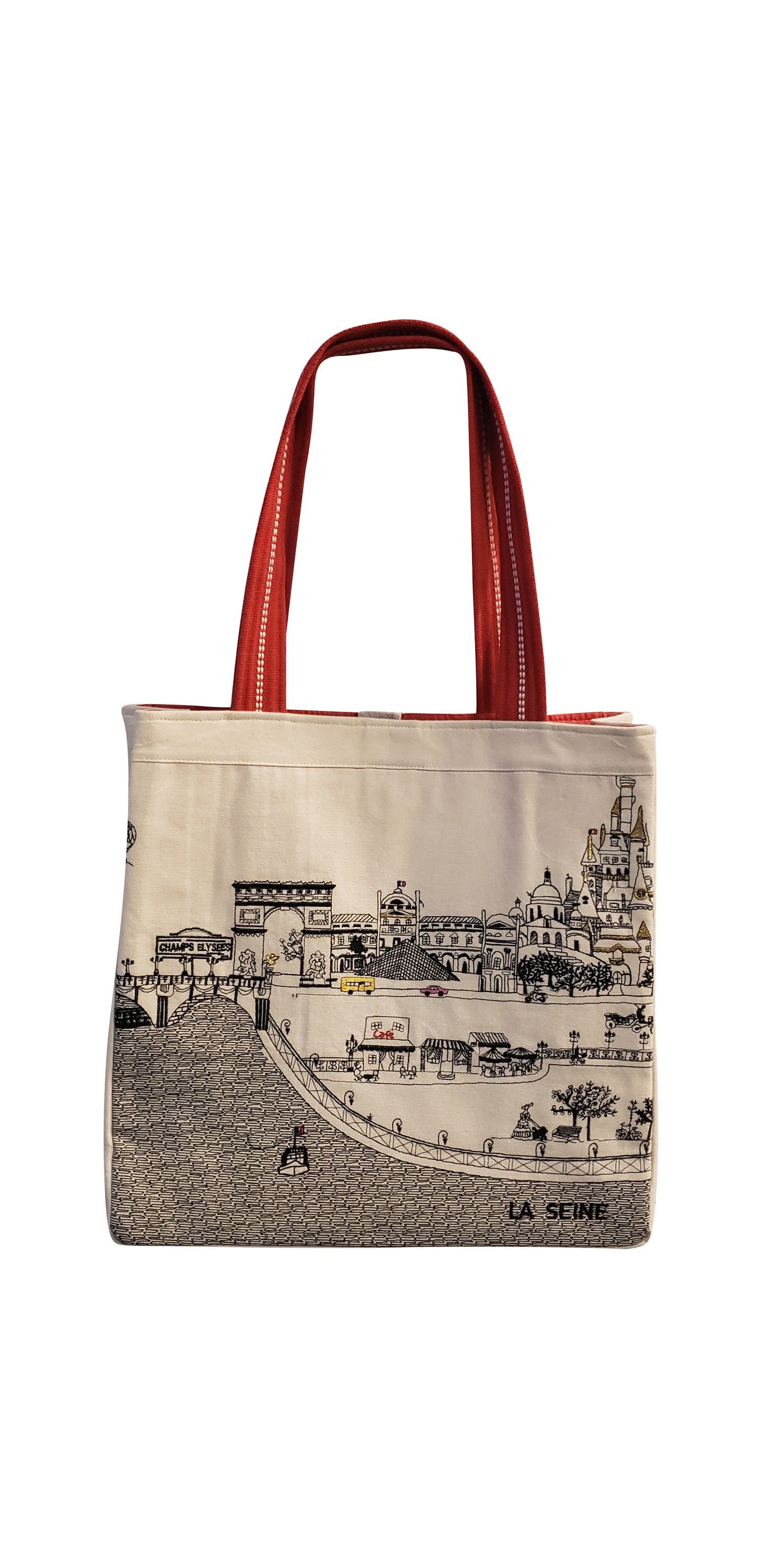 Stylish Paris Tote Bag with embroidered skyline in cream and black colors, featuring red waterproof lining and ribbed straps.