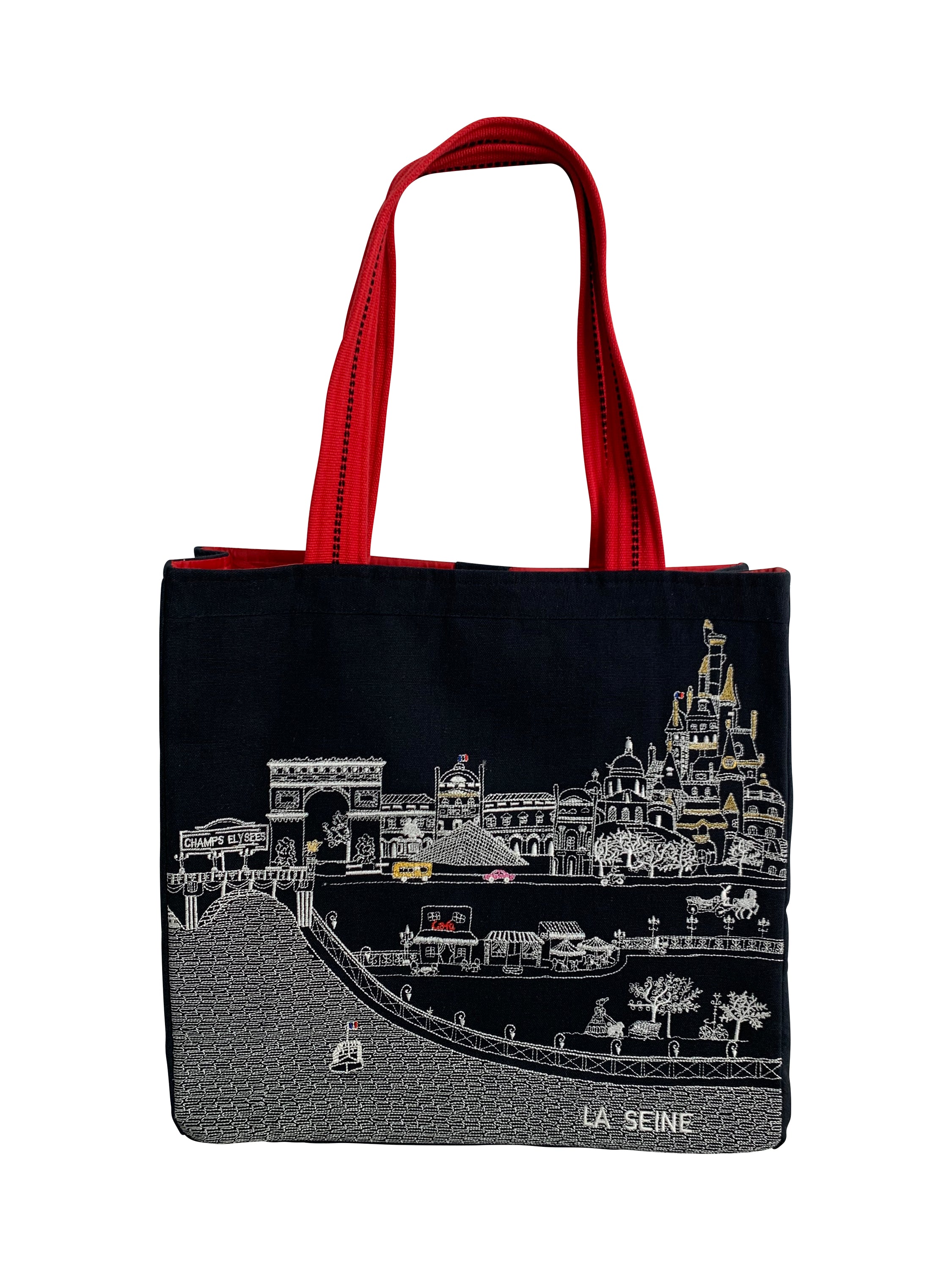 Stylish Paris Tote Bag with embroidered skyline in cream and black colors, featuring red waterproof lining and ribbed straps.