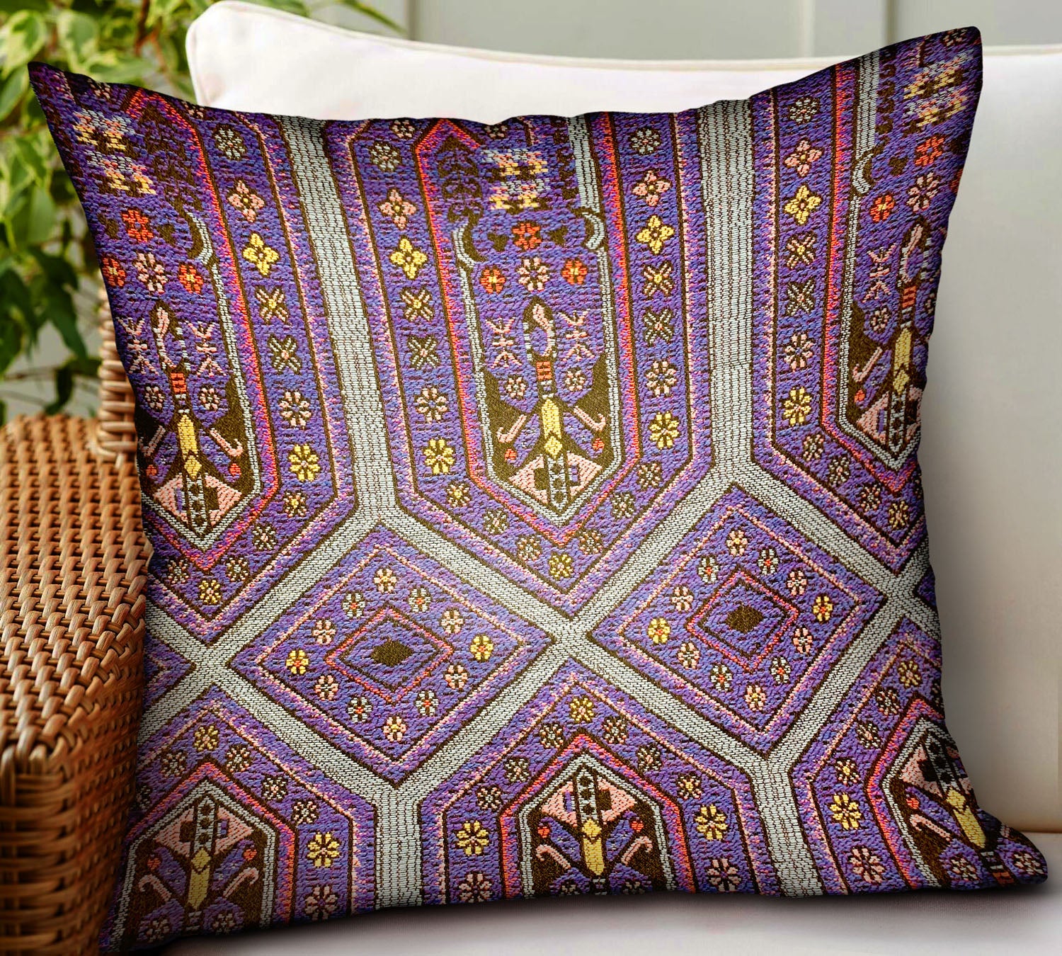 A luxurious purple geometric throw pillow designed for indoor and outdoor use, featuring a durable Sunbrella fabric and a stylish double-sided design.