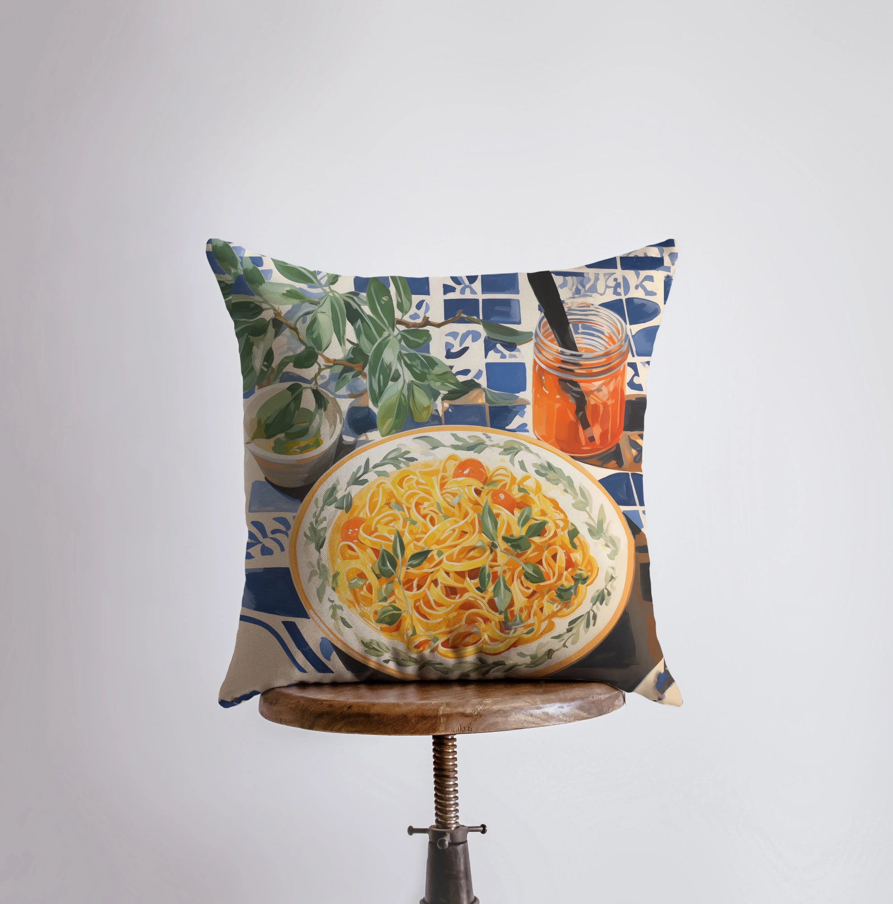 Pasta Picnic pillow featuring a vibrant gouache painting of a food scene, with a concealed zipper and a white back, available in various sizes.