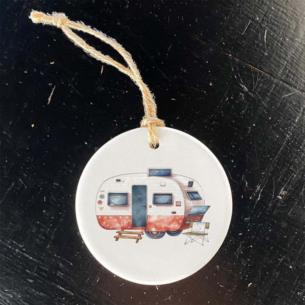 A beautifully crafted porcelain ornament featuring a patriotic camper design, showcasing vibrant colors and a glossy finish.