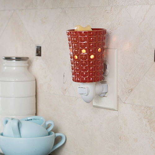 Pebblestone Pluggable Warmer with brick reactive glaze and geometric pattern, designed for versatile outlet use.