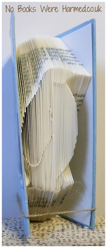 Handcrafted Penguin book art made from vintage pages, showcasing unique folds and intricate design.