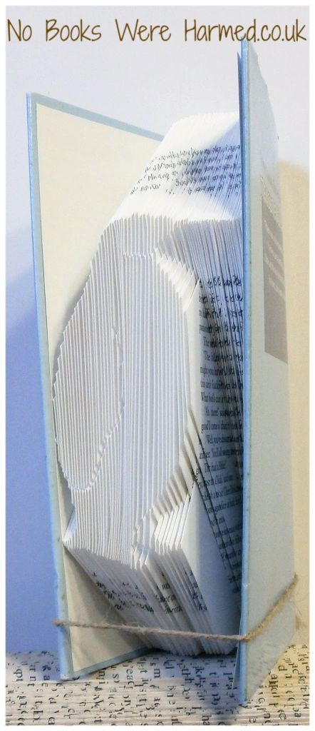 Handcrafted Penguin book art made from vintage pages, showcasing unique folds and intricate design.