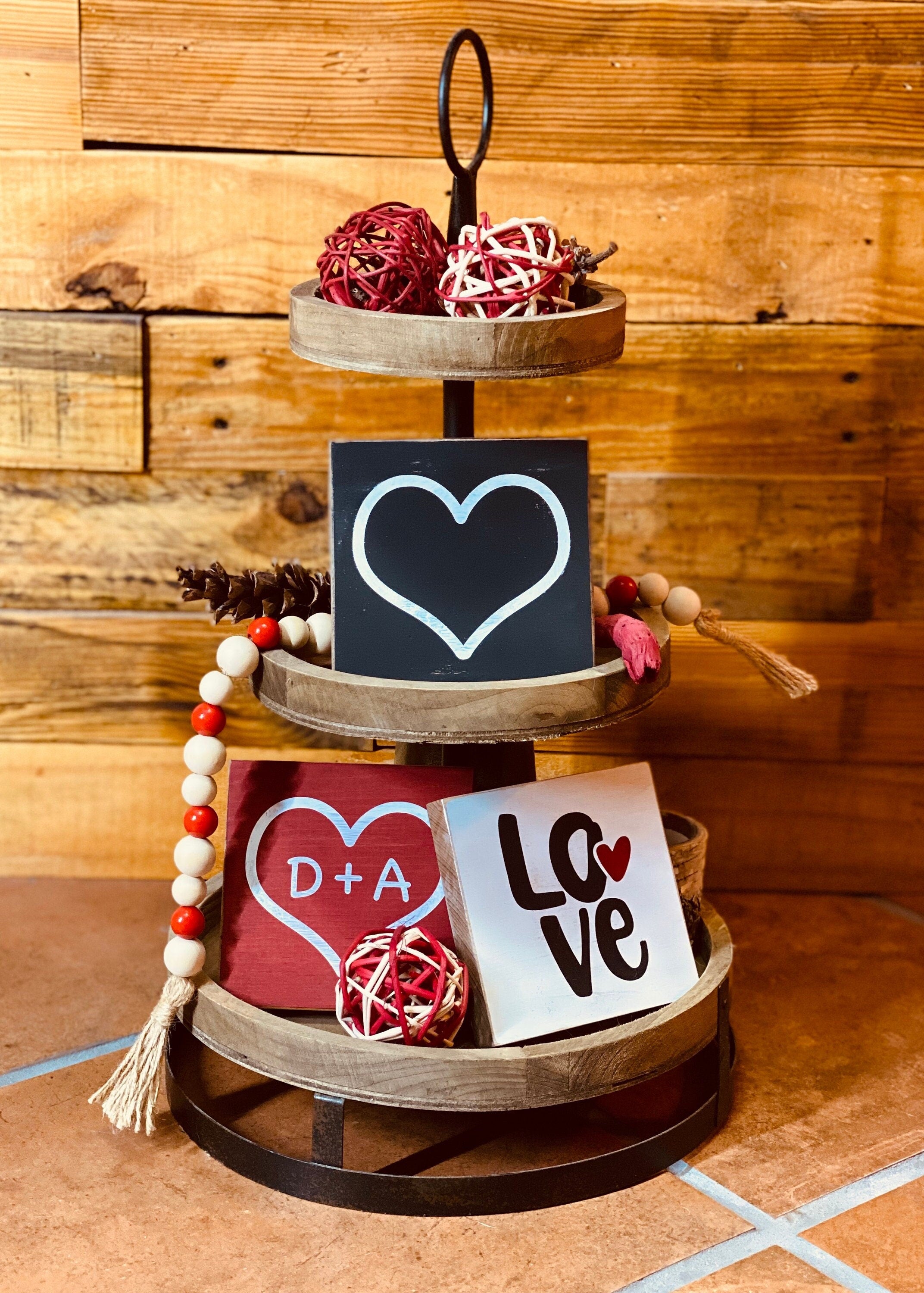 Personalized Valentine's Day Tiered Tray Set featuring hand-painted signs in red, black, and white with heart designs and initials.