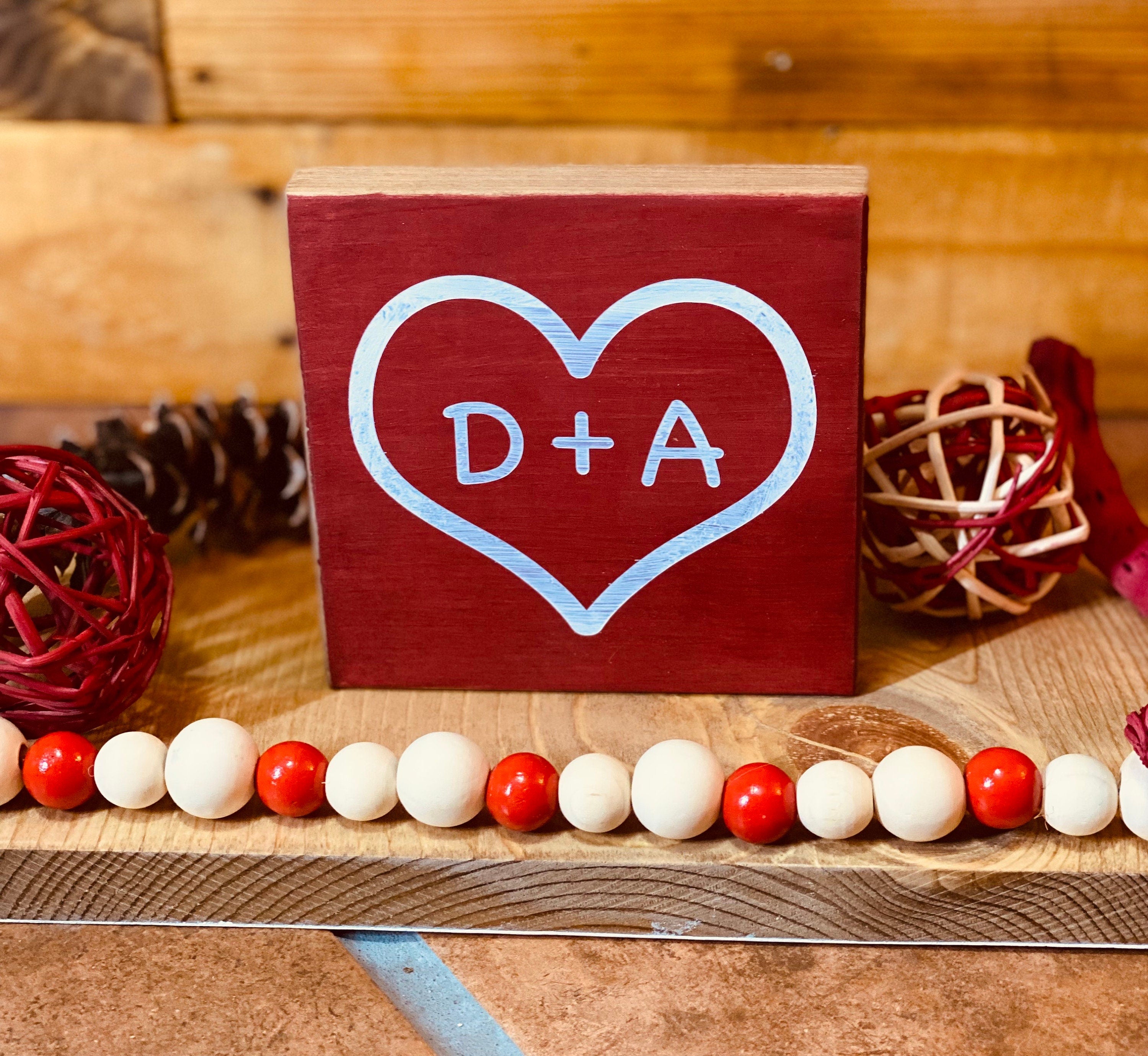 Personalized Valentine's Day Tiered Tray Set featuring hand-painted signs in red, black, and white with heart designs and initials.