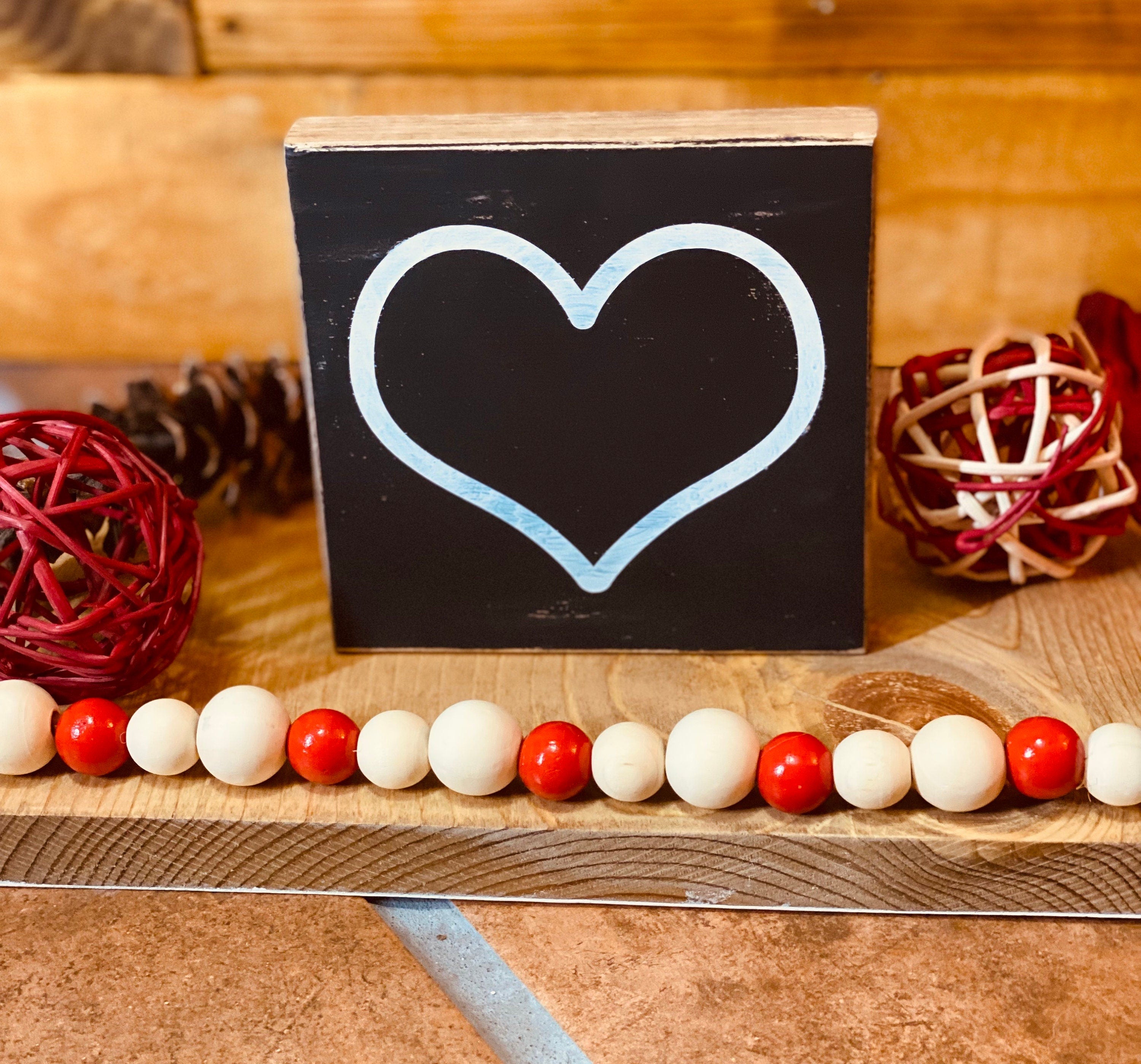 Personalized Valentine's Day Tiered Tray Set featuring hand-painted signs in red, black, and white with heart designs and initials.