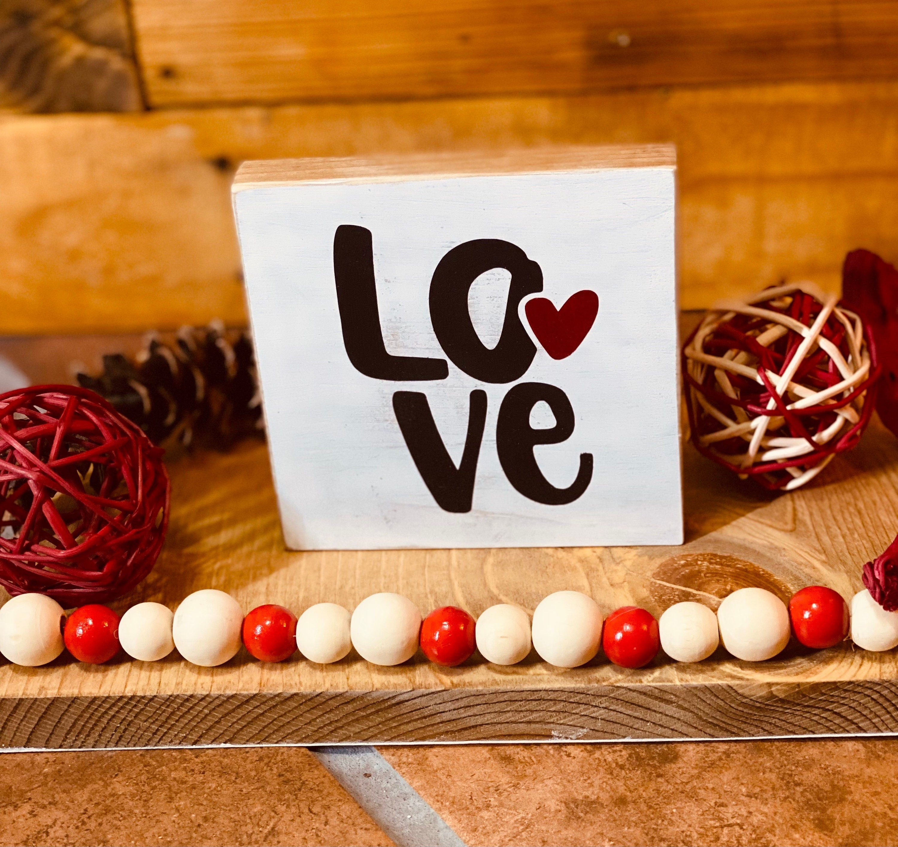 Personalized Valentine's Day Tiered Tray Set featuring hand-painted signs in red, black, and white with heart designs and initials.