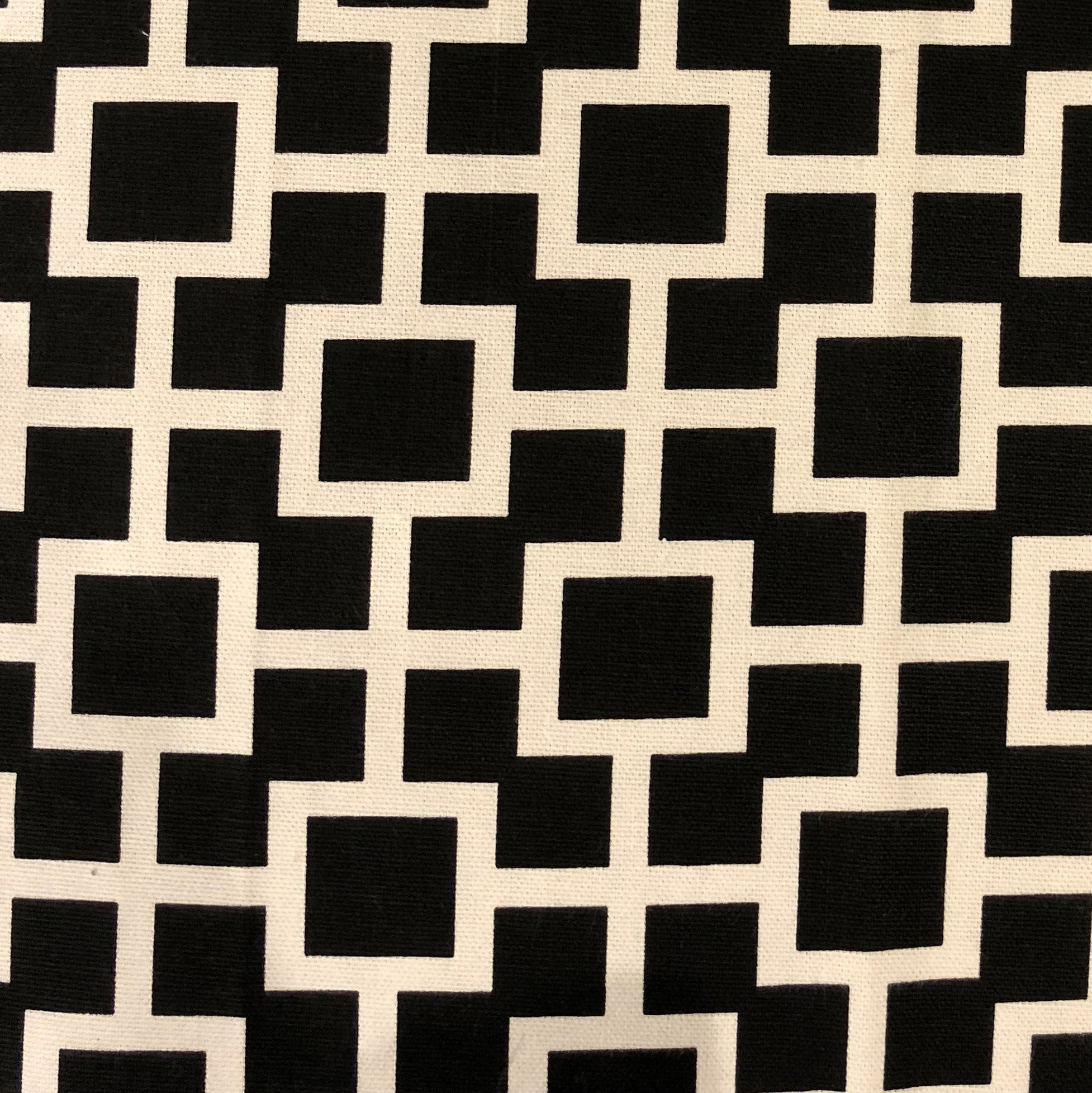 Petunia Black and White Luxury Throw Pillow featuring a geometric pattern, handmade in the USA with a soft cotton fabric.