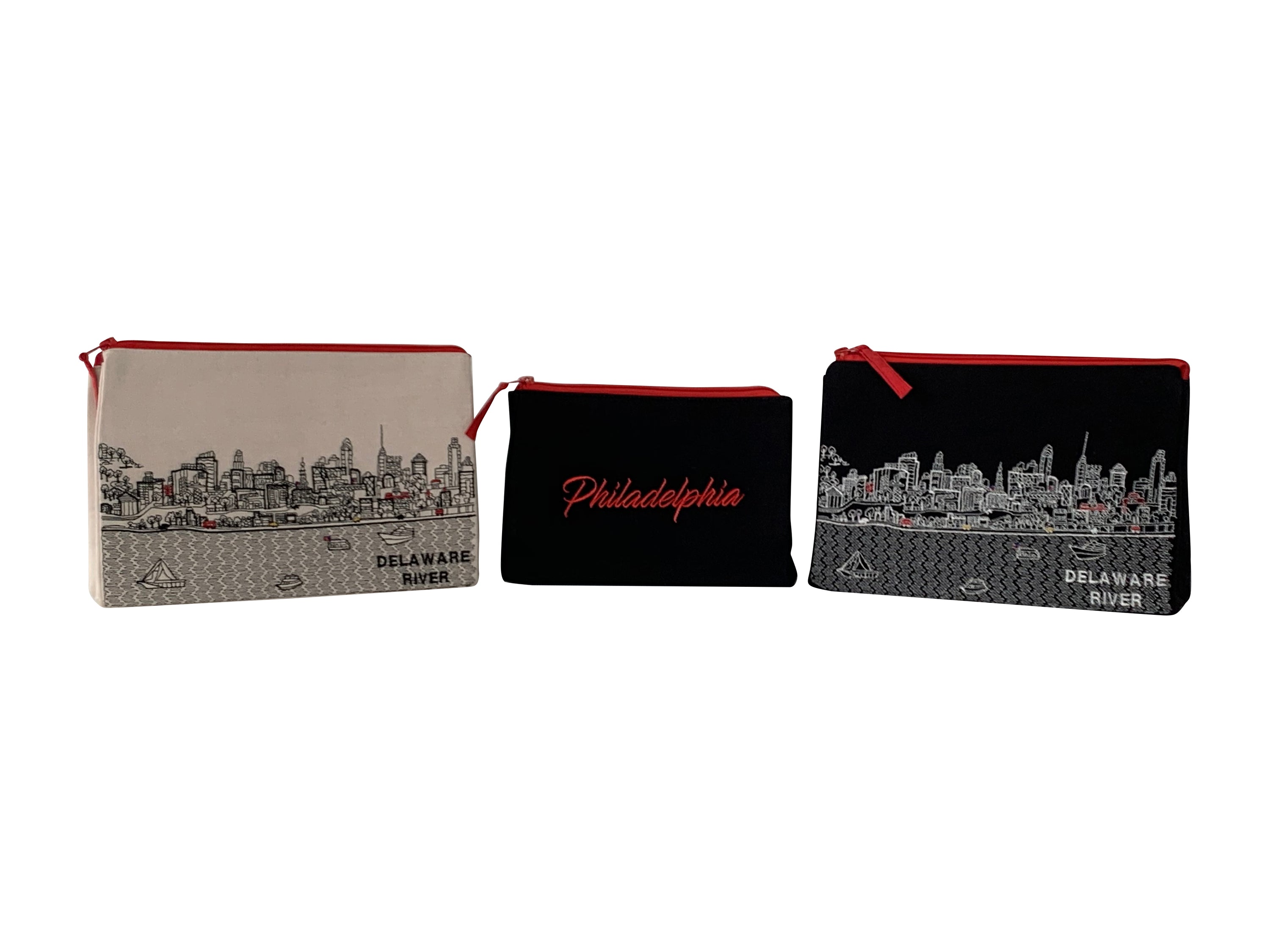 Philadelphia Makeup Bag set featuring embroidered skyline design on cream and black cotton canvas with red waterproof lining.