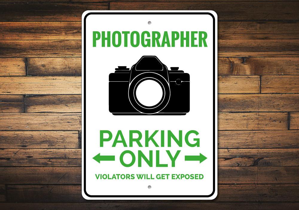 A customizable Photographer Parking Sign made from high-quality aluminum, featuring pre-drilled holes for easy mounting.