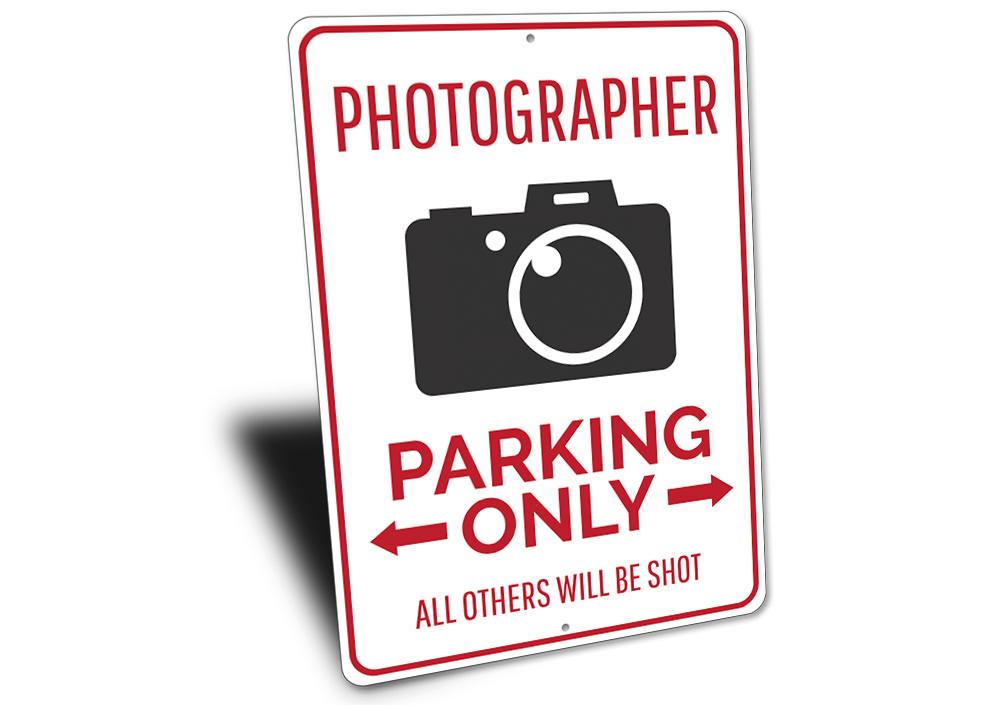 A customizable Photographer Parking Sign made of high-quality aluminum, featuring a unique design suitable for various vehicles.