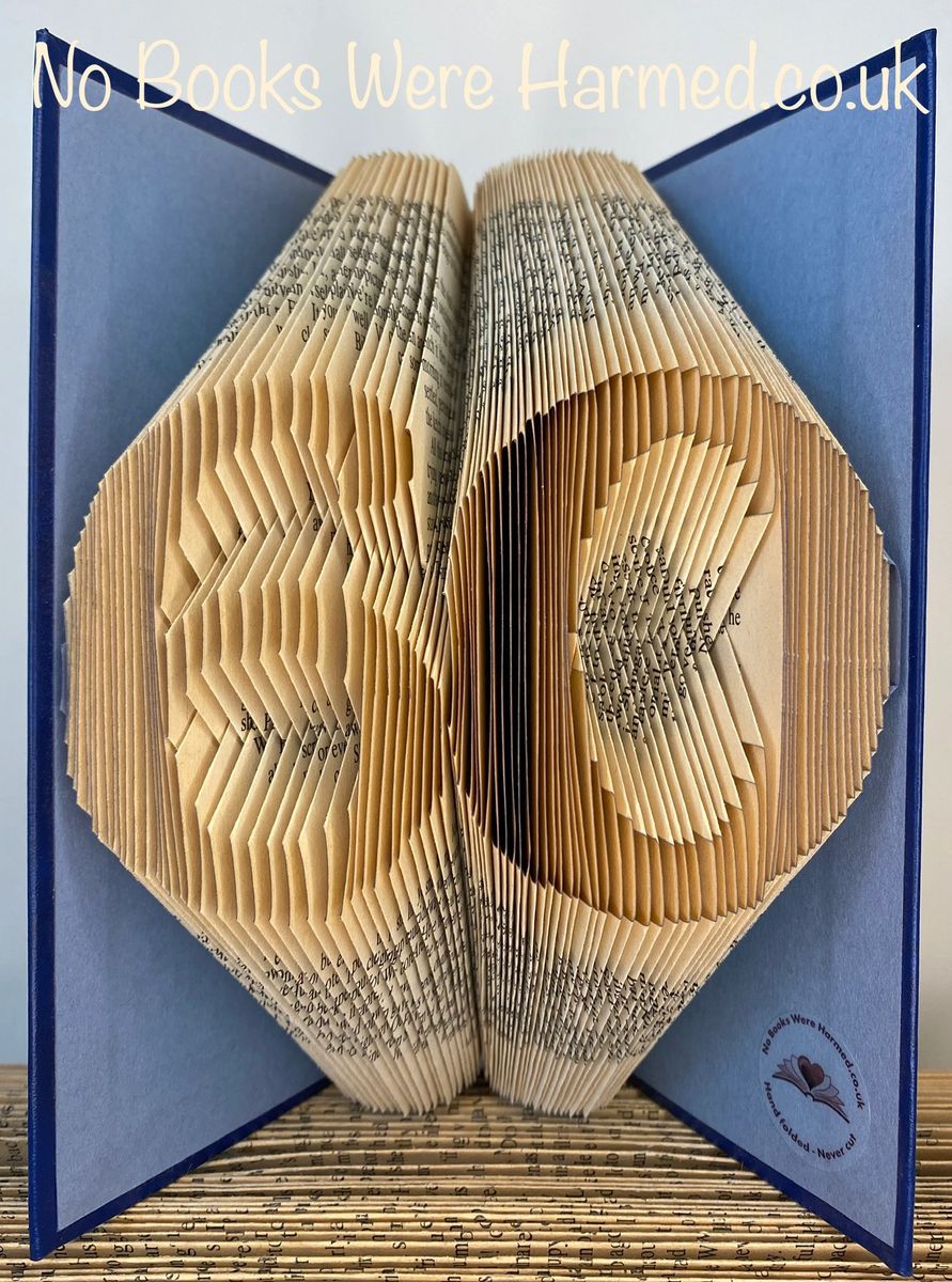 Handcrafted book art featuring a customizable two-digit number, made from vintage pages with intricate folds.