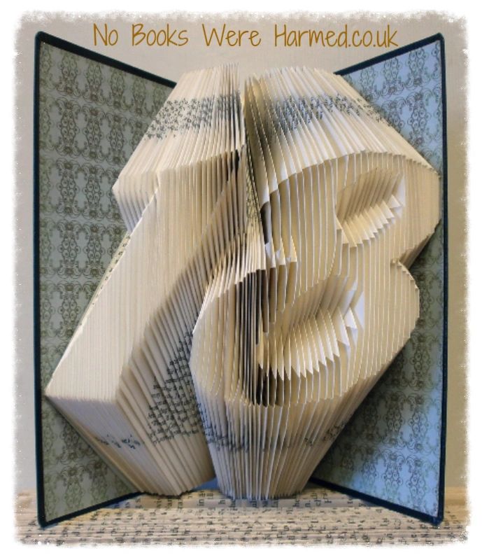 Handcrafted book art featuring a customizable two-digit number, made from vintage pages with intricate folds.