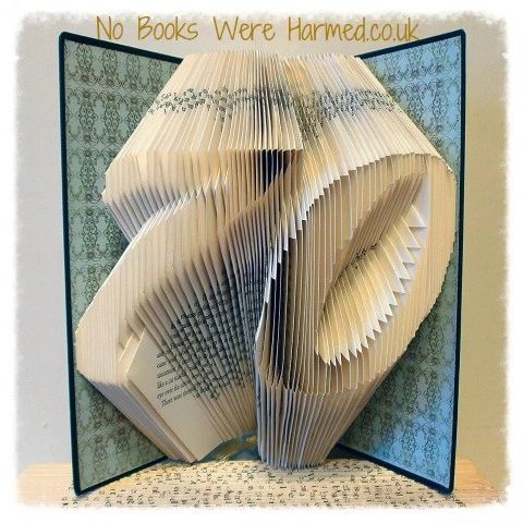 Handcrafted book art featuring a customizable two-digit number, made from vintage pages with intricate folds.