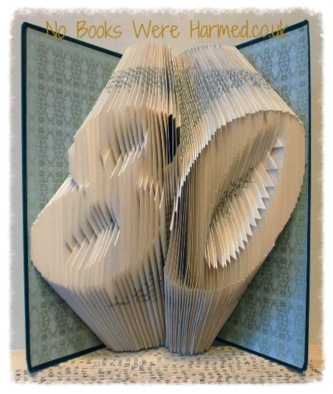 Handcrafted book art featuring a customizable two-digit number, made from vintage pages with intricate folds.