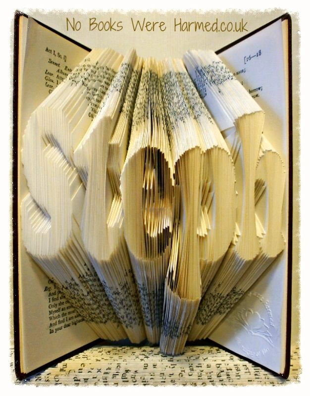 Custom book art featuring hand-folded letters from vintage books, showcasing unique designs and colors.