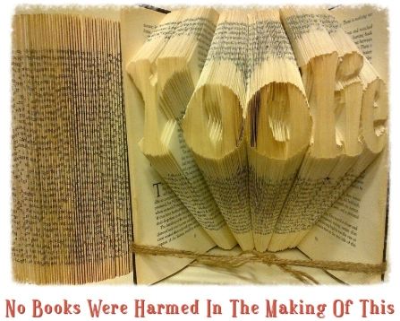 Custom book art featuring hand-folded letters from vintage books, showcasing unique designs and colors.