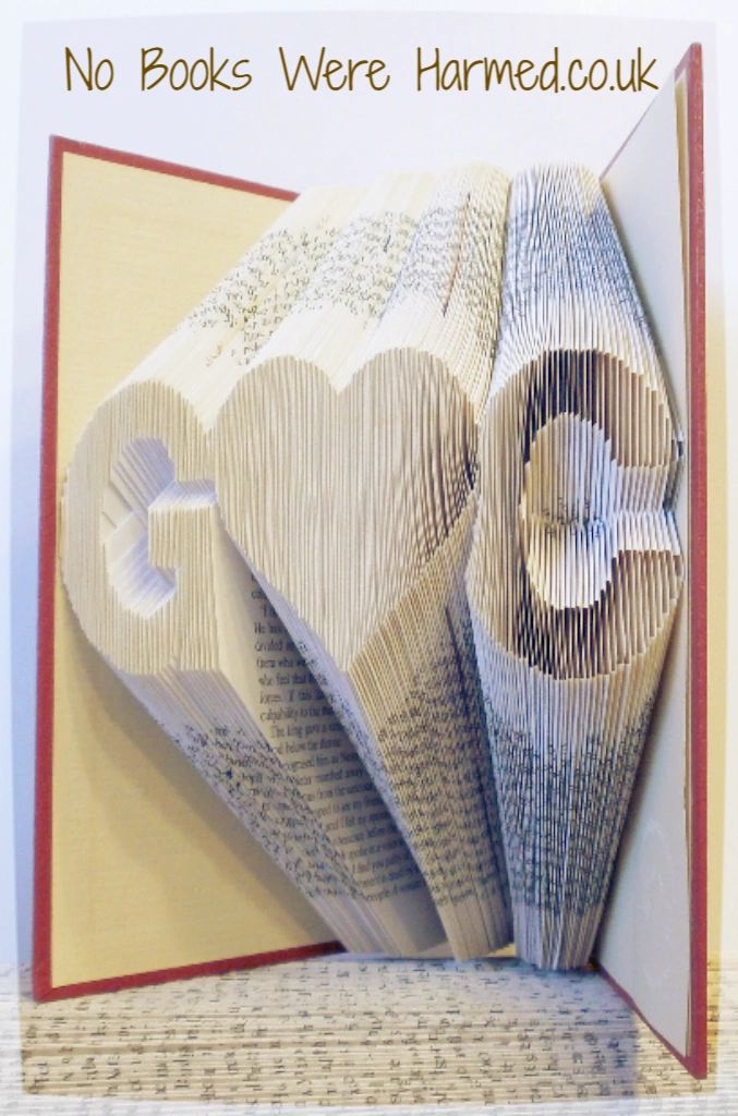 Personalized book art featuring initials beside a love heart, handcrafted from vintage pages.