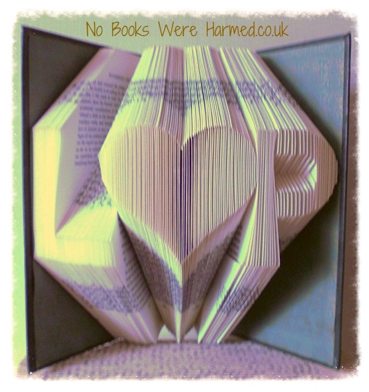 Personalized book art featuring initials beside a love heart, handcrafted from vintage pages.