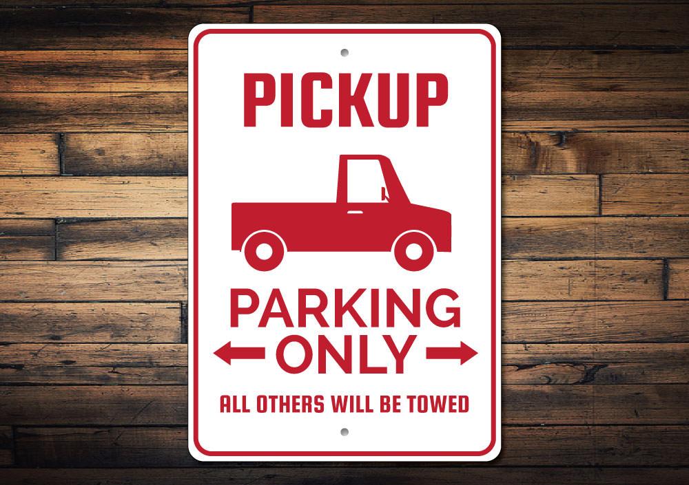 A Pickup Truck Parking Sign made of durable aluminum, featuring customizable text and pre-drilled holes for easy mounting.