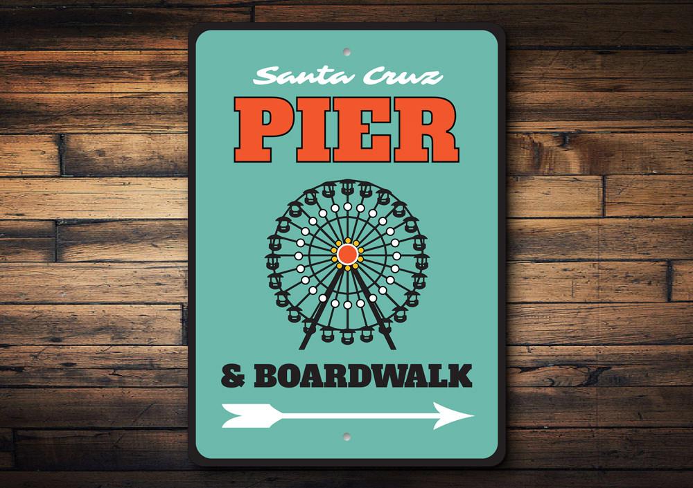 A decorative Pier and Boardwalk Sign made of high-quality aluminum, featuring coastal-themed designs, perfect for beach houses and outdoor decor.