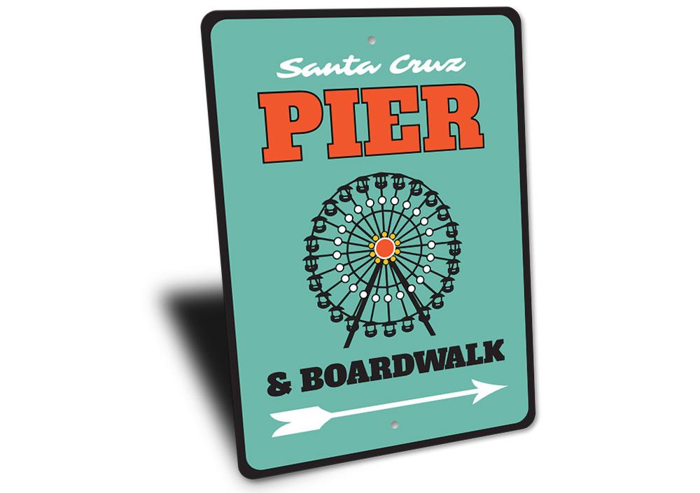 A decorative Pier and Boardwalk Sign made of high-quality aluminum, featuring coastal-themed designs, perfect for beach houses and outdoor decor.