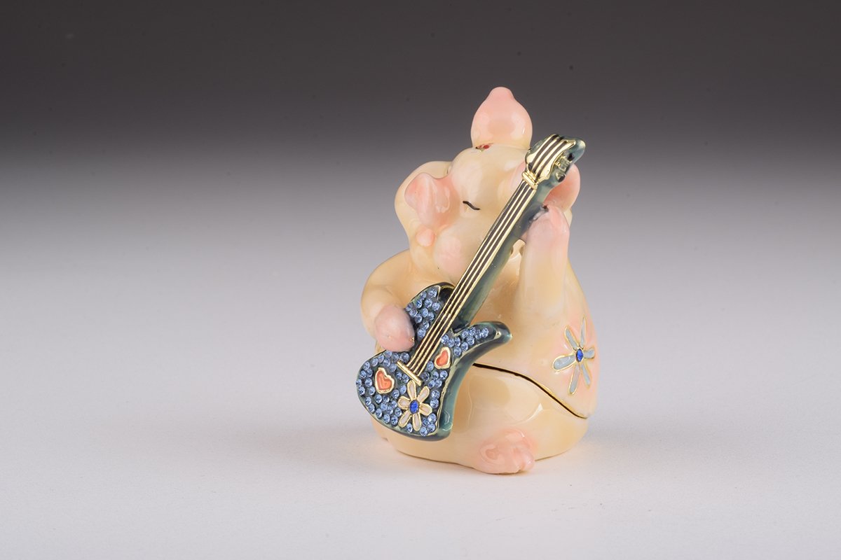 A beautifully crafted enamel trinket box featuring a pig playing guitar, adorned with sparkling Austrian crystals and plated with gold or silver.