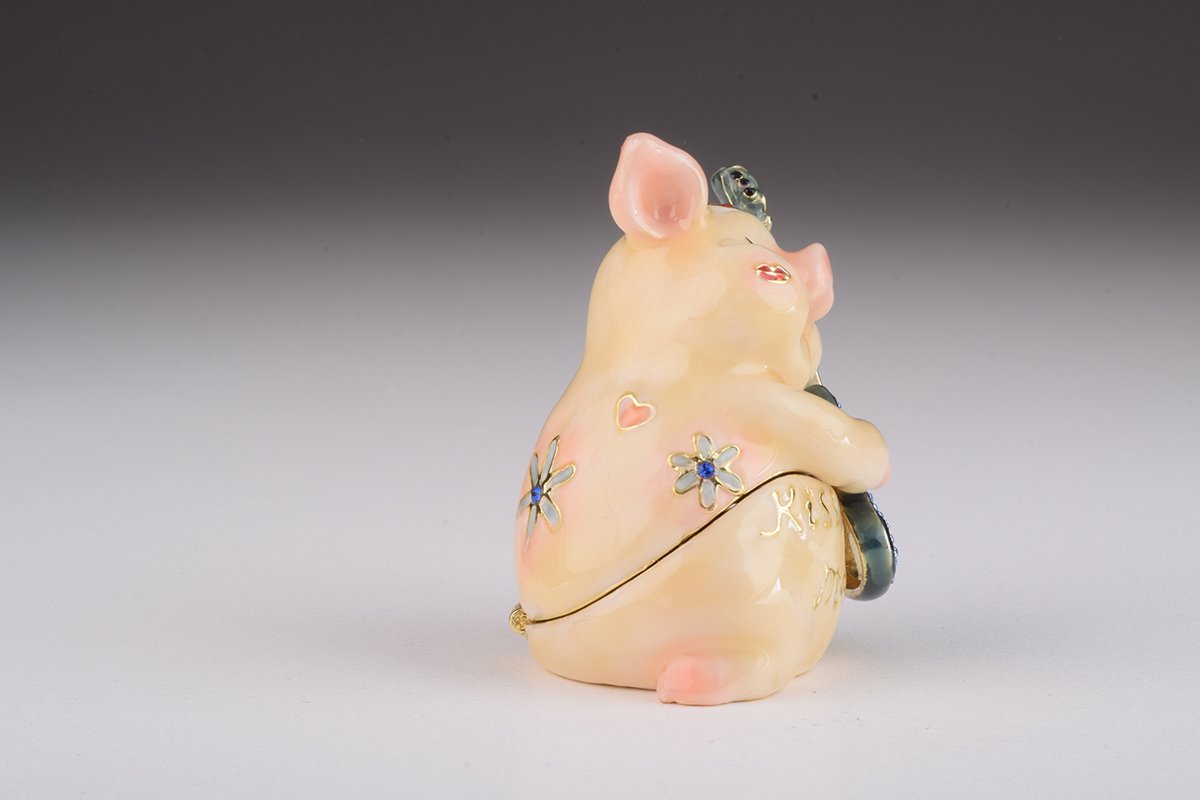 A beautifully crafted enamel trinket box featuring a pig playing guitar, adorned with sparkling Austrian crystals and plated with gold or silver.