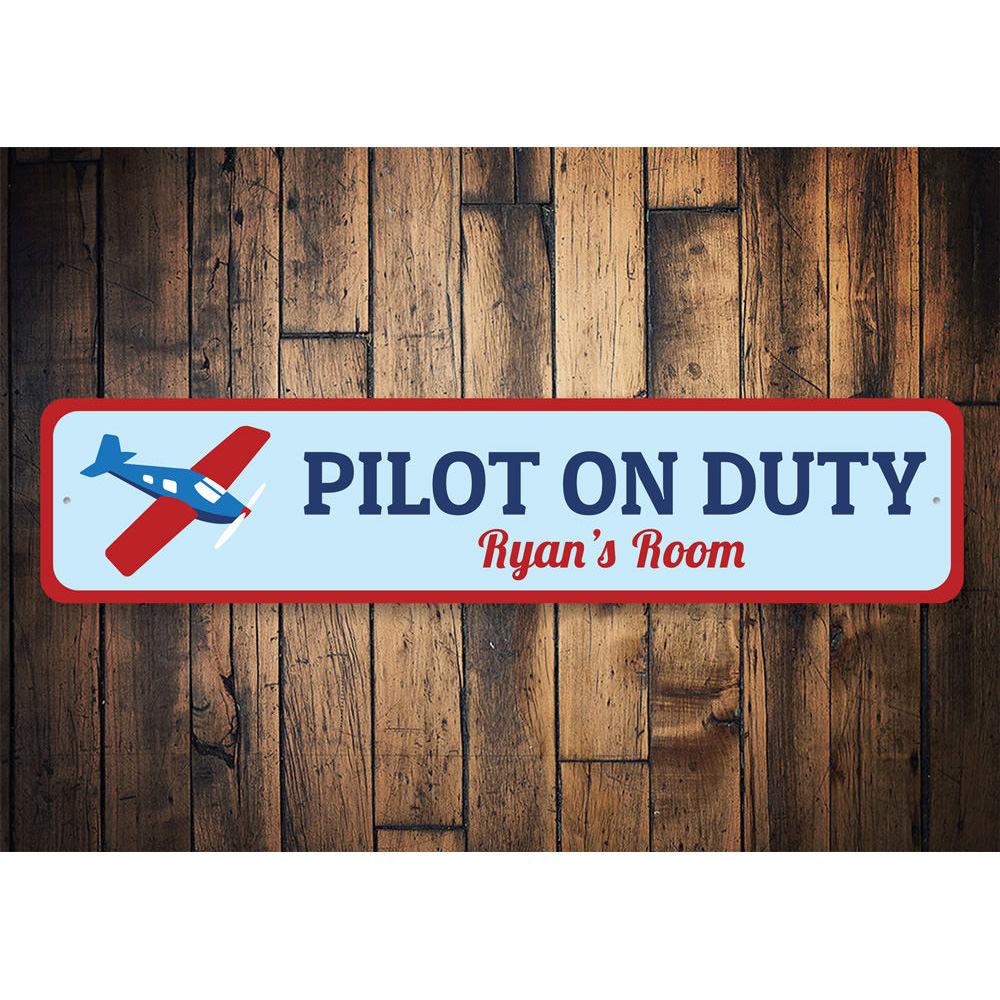 Pilot On Duty Sign made of high-quality aluminum, featuring customizable text and pre-drilled holes for easy mounting.