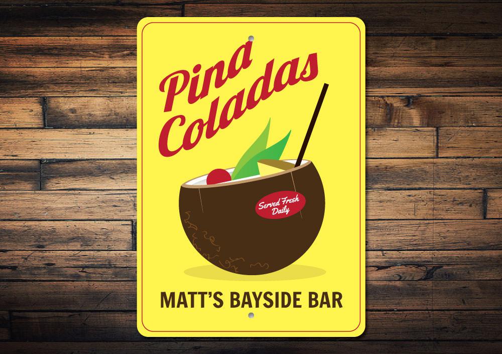 A vibrant Pina Colada Sign made of aluminum, featuring tropical design elements, perfect for home decor.