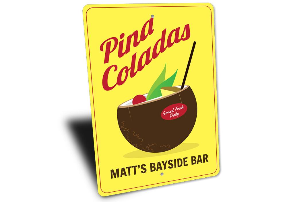 A vibrant Pina Colada Sign made of aluminum, featuring tropical design elements, perfect for home decor.