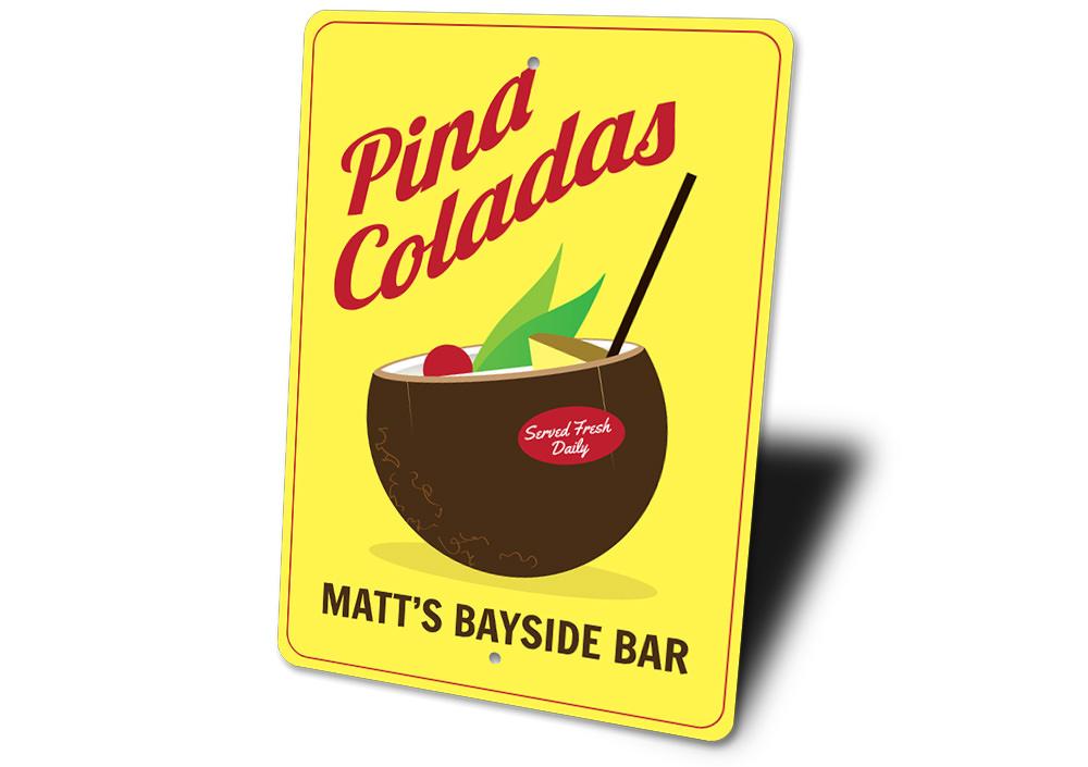 A vibrant Pina Colada Sign made of aluminum, featuring tropical design elements, perfect for home decor.