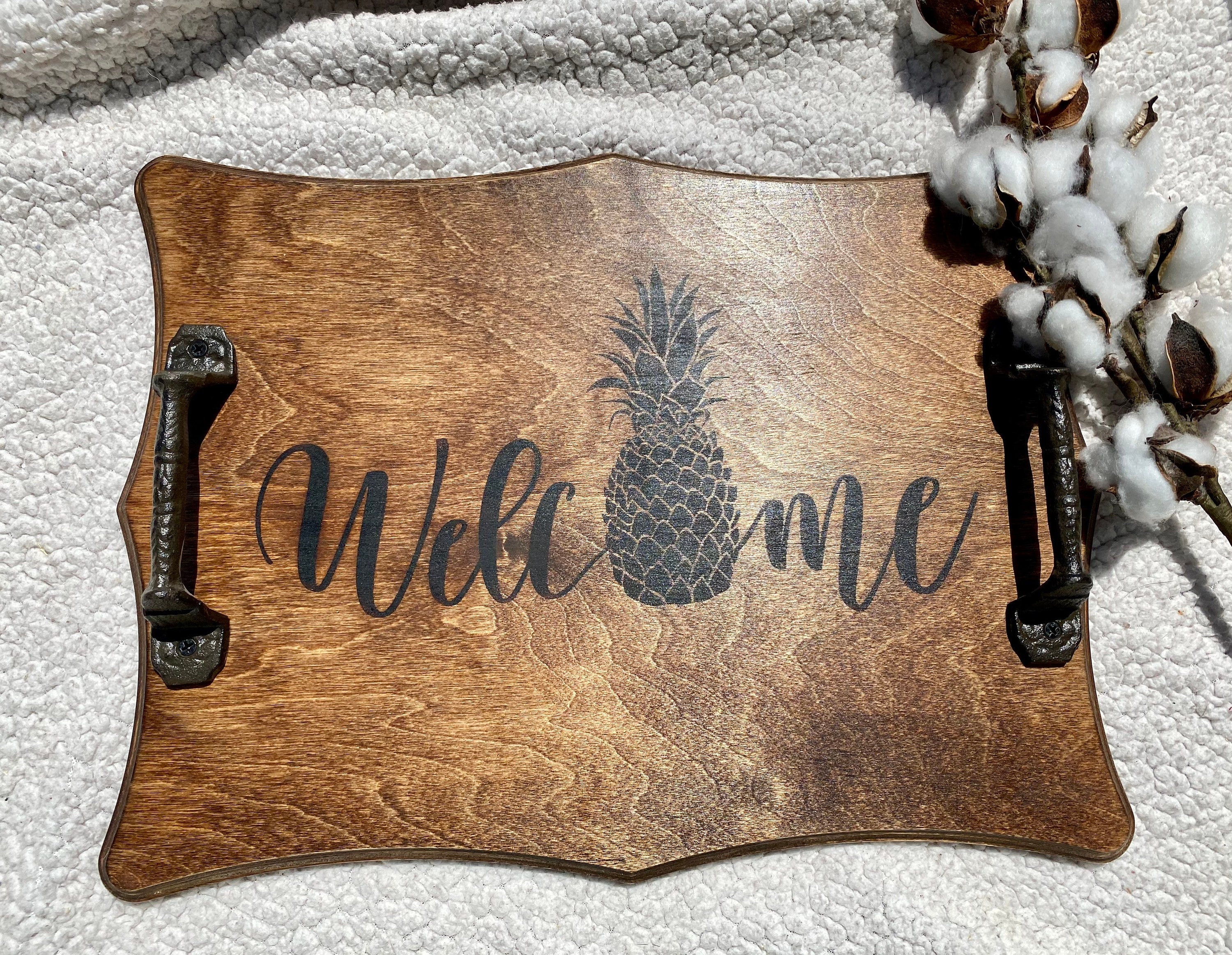 Handmade wooden Pineapple Serving Tray with rich chestnut stain and cast iron handles, perfect for kitchen decor.