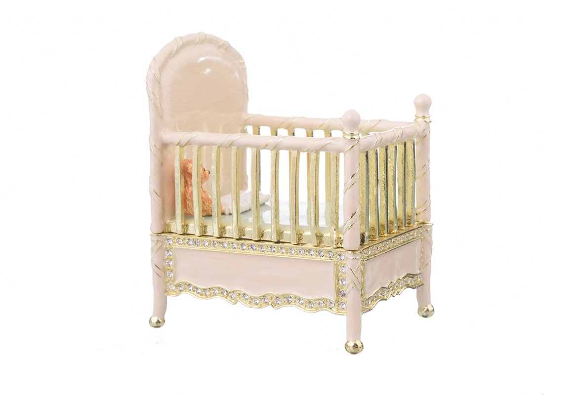 A beautifully crafted Pink Baby Bed trinket box, handmade with enamel and adorned with sparkling Austrian crystals, featuring a luxurious gold or silver plating.